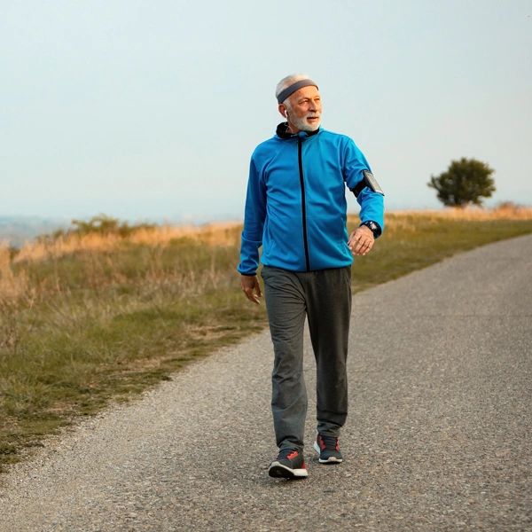 Full Length Senior Sportsman Taking Walk Morning Listening Music Earphones Nature Copy Space